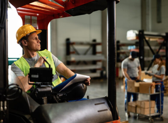 a worker sitting on forklift